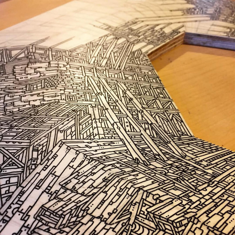 lukisan tangan bergambar bangunan di kayu © 2016 hifructose