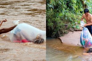 Aksi pria bantu anak-anak seberangi sungai saat ke sekolah ini unik
