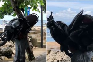 Viral pria gendong motor di bahu, bikin netizen melongo