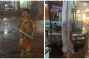 Aksi heroik seorang ibu selamatkan bendera merah putih di tengah badai