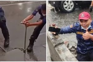 Aksi petugas damkar selamatkan HP warga di got saat hujan, bikin salut