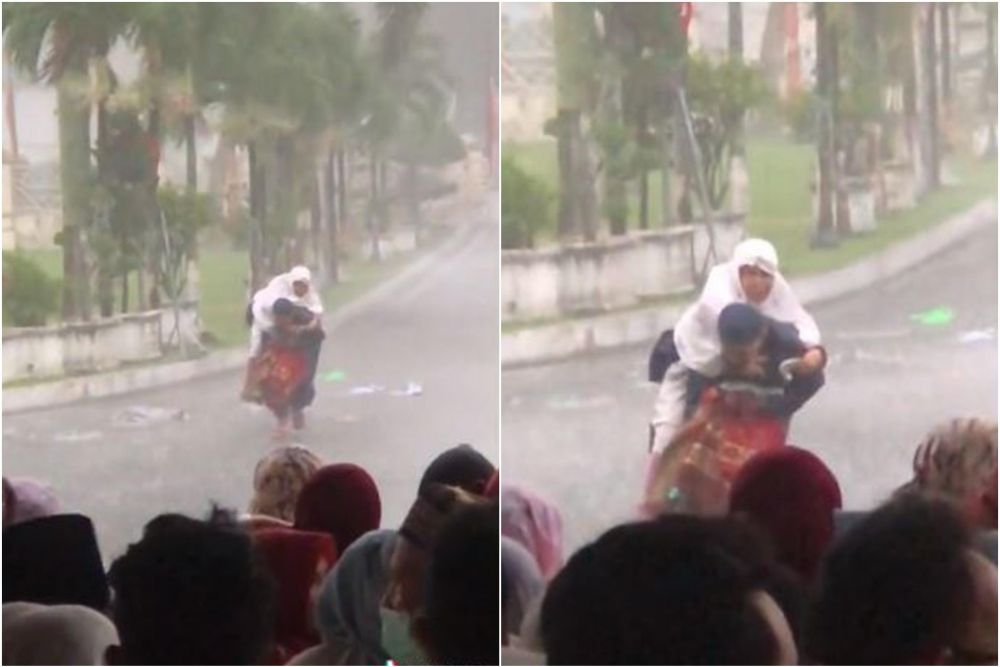 Momen haru anak gendong ibu saat hujan deras jelang sholat Idul Fitri