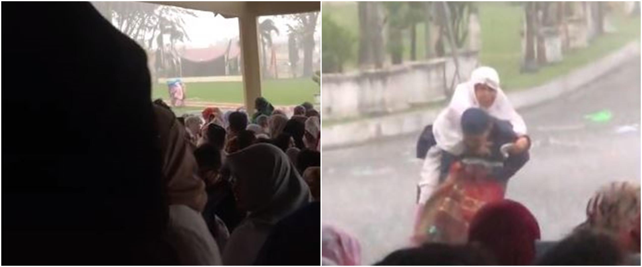 Momen haru anak gendong ibu saat hujan deras jelang sholat Idul Fitri