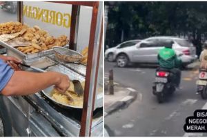 Aksi penjual goreng risol di tengah lampu merah, bikin geleng kepala