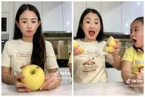 Tak perlu pakai pisau, begini cara membelah buah apel menggunakan tangan