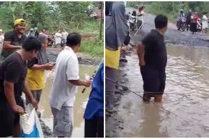 Momen kocak warga Bengkulu Utara mancing di jalanan berlubang ini tuai sorotan, aksinya nyindir abis