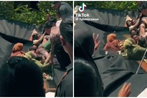 Momen apes pengantin nyemplung di kolam saat sesi foto bareng ini bikin pengin ketawa tapi takut dosa