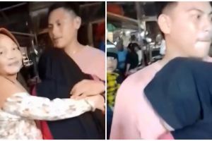 Momen wanita menangis peluk pria asing di pasar ini kisahnya bak sinetron, alasannya bikin terenyuh