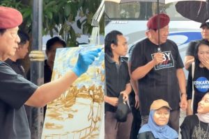 11 Potret semangat SBY melukis di tepi Bengawan Solo meski diguyur hujan
