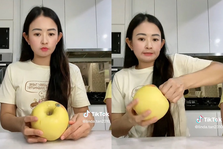 Tak perlu pakai pisau, begini cara membelah buah apel menggunakan tangan
