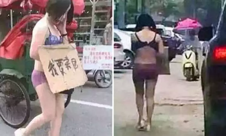 Diduga selingkuh, istri diarak semi telanjang suaminya di jalanan umum