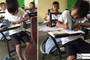 Siswa SD ini hapus tulisan di buku pakai sandal, duh kasihan!