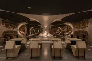 Bangunan perpustakaan ini keren banget, bikin pengen baca buku di sana