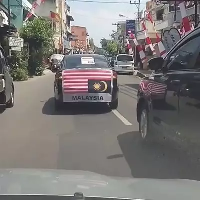 Beredar video mobil keliling kota bawa bendera Malaysia terbalik