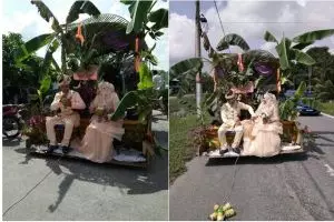 Pasangan ini nikah dengan dekorasi pohon pisang, diarak keliling desa