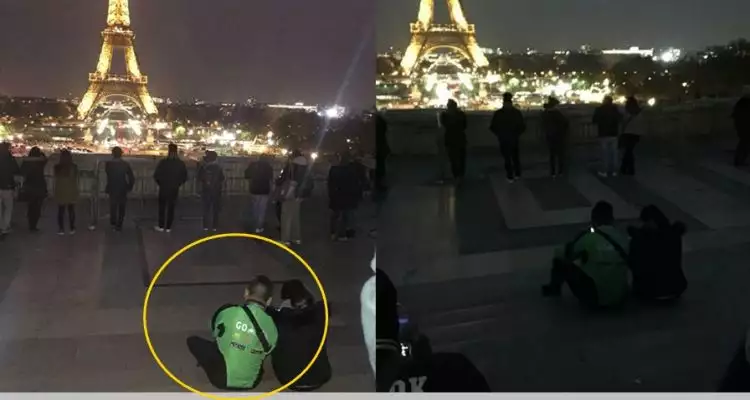 Viral, pria berjaket ojek online nongkrong di dekat Menara Eiffel