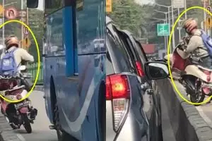 Bantu angkat motor dari separator busway, nasib pria ini apes banget