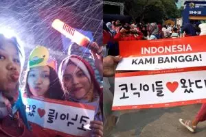 5 Aksi total fans iKon menunggu idolanya di GBK, rela hujan-hujanan