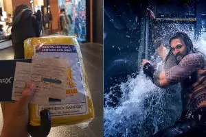 Nonton Aquaman, orang ini bawa payung dan jas hujan ke bioskop