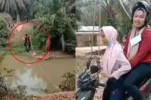 Viral, naik motor menyeberang sungai pakai tali ini bak flying fox