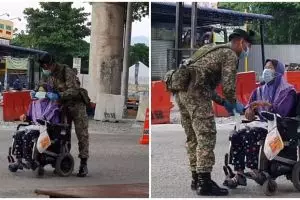 Kisah haru tentara pasangkan masker lansia berkursi roda
