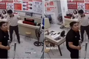 Pegawai toko ini kaget karena pintu kaca pecah tanpa sebab