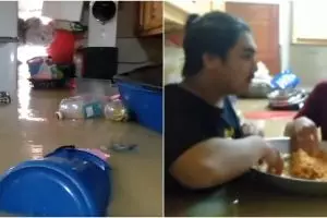 Terjebak banjir, cara makan pemuda ini jadi sorotan