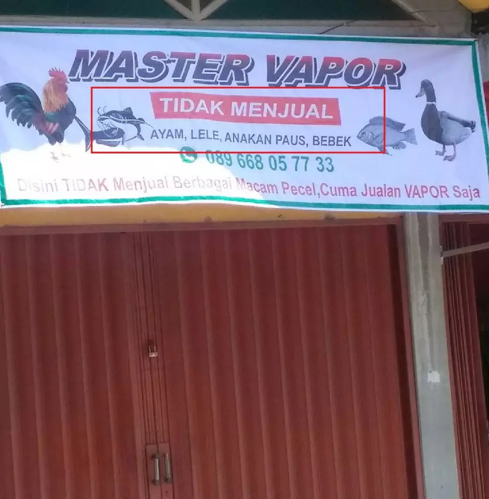 Keterangan di spanduk toko © Twitter Keterangan di spanduk toko © Twitter