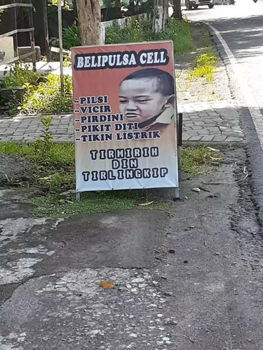 spanduk huruf vokal I © berbagai sumber