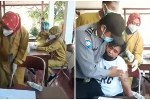 Takut divaksin, ekspresi wajah pria bertato saat disuntik jadi sorotan