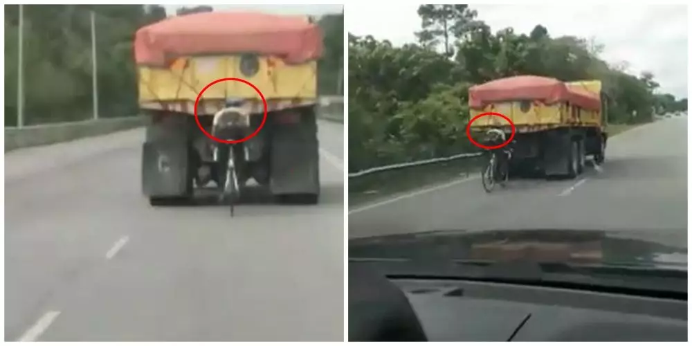 Aksi pesepeda 'mepet' truk © Twitter