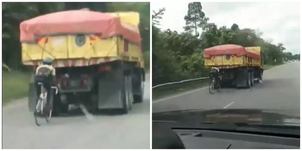 Aksi pesepeda 'mepet' truk © Twitter