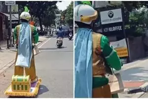 Viral aksi driver ojek online antarkan pesanan pakai outfit Aladdin