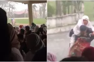 Momen haru anak gendong ibu saat hujan deras jelang sholat Idul Fitri