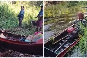 Aksi nenek kendarai perahu di sungai, andal lewati gundukan tanah