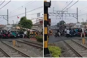 Momen pengendara terobos palang rel kereta ini menegangkan, aksi petugas perlintasan bikin angkat topi