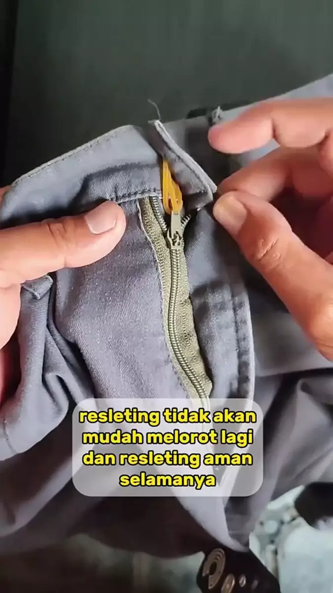 No need to replace it, here's a trick for dealing with trouser zippers