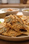 Capek hasilnya alot dan keras? Ini cara goreng ikan asin agar renyah cuma pakai 1 bahan dapur